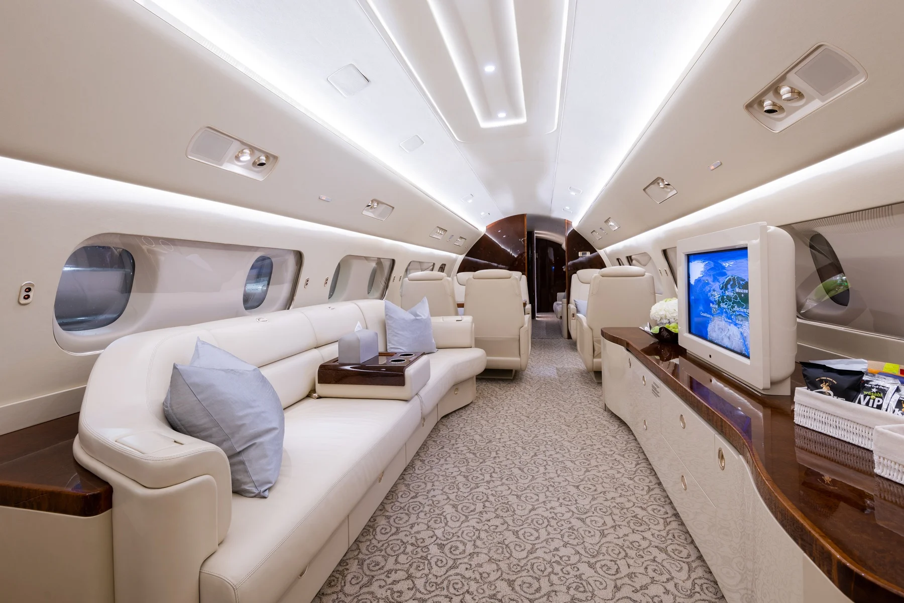 Cream leather cabin seating in a luxury private jet.