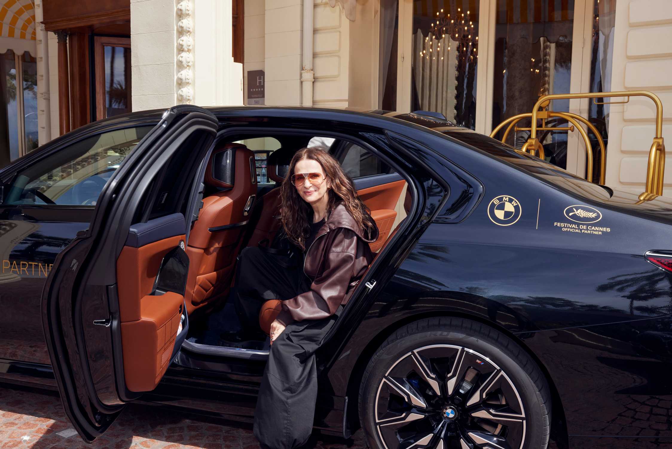 Elegantly dressed woman arriving at the Cannes Film Festival.